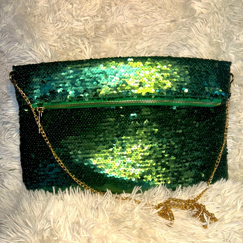 Emerald green sequin cross body bag with a gold zipper and gold chain strap.